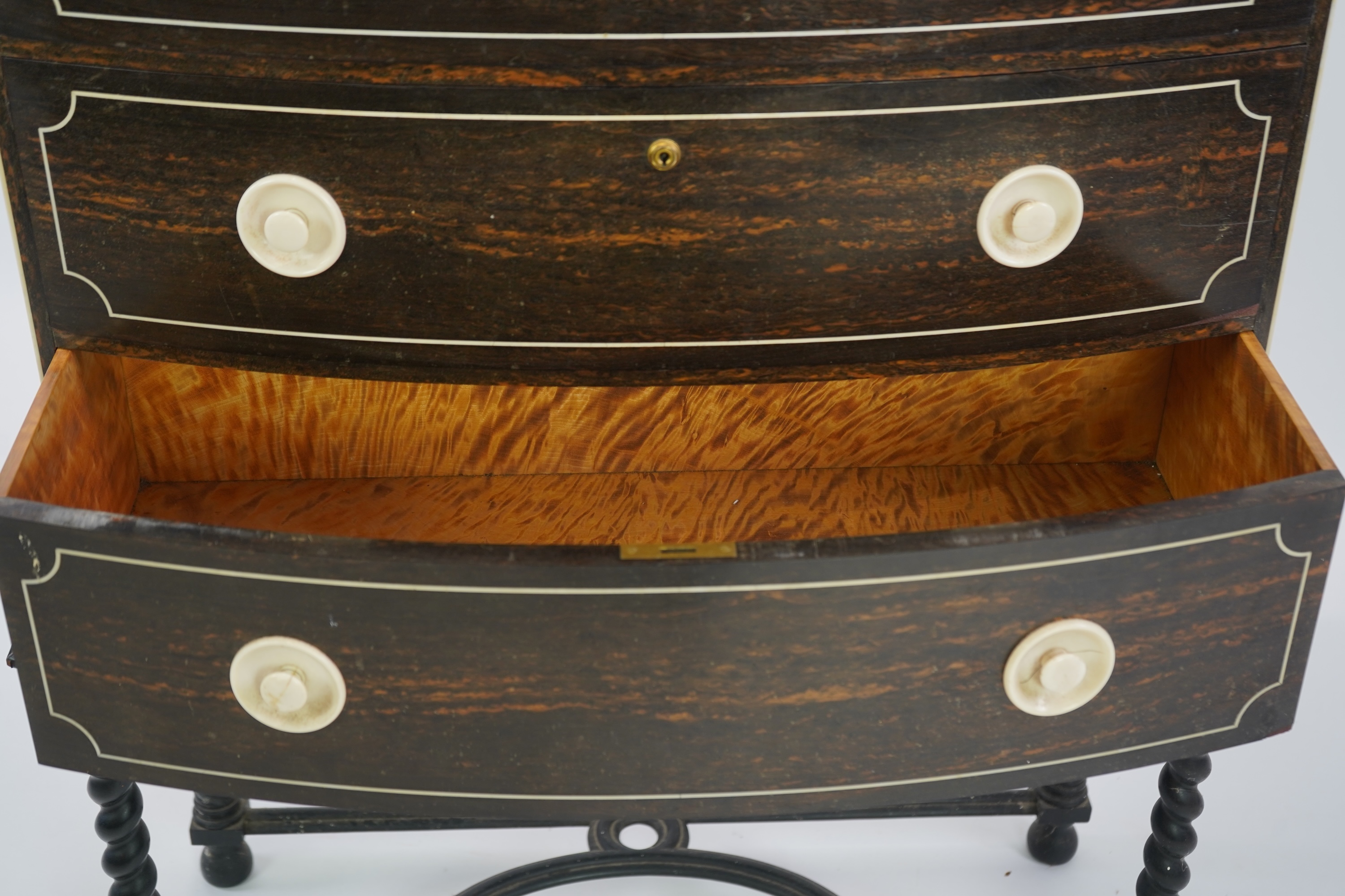 An early 20th century ivory mounted coromandel three drawer bowfront chest, stamped Callow of Mount Street, London